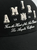 AMIRI VARSITY TRUCKER HAT